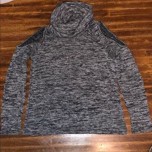 Turtleneck sweater with open shoulders